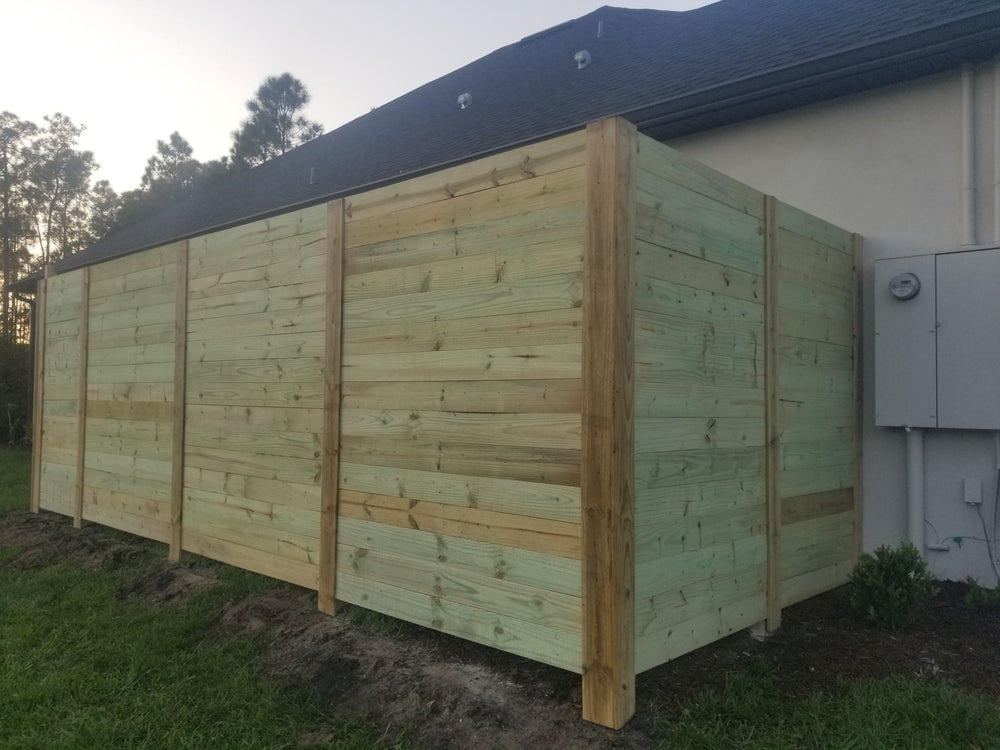 Wood fence installation by Jay Fencing
