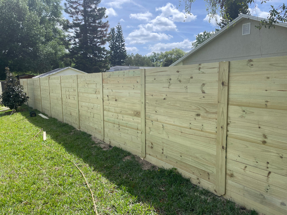 Wood fence installation by Jay Fencing